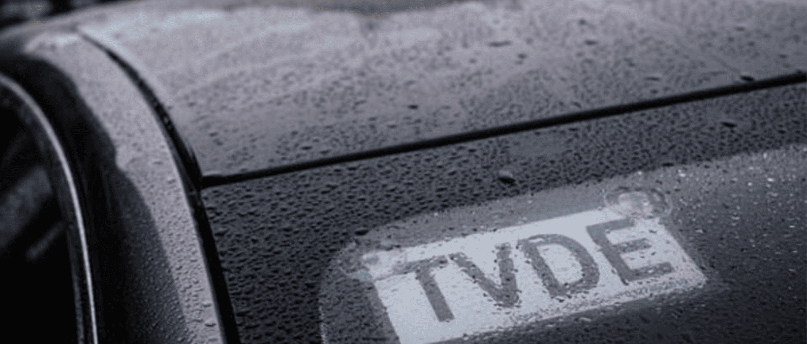 TVDE sign on the windshield of cars like Uber, Bolt and other car rental services in Portugal