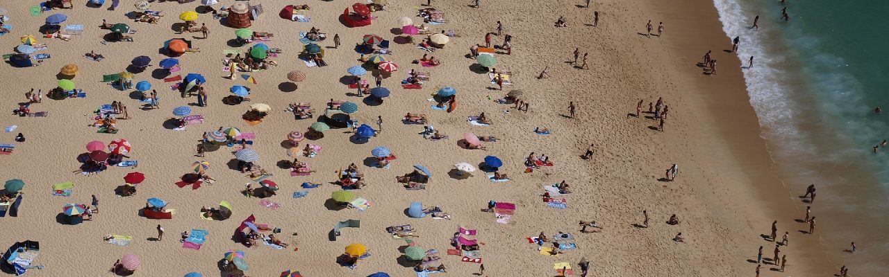 Algarve Beach aerial view of the summer crowds of an algarve beach